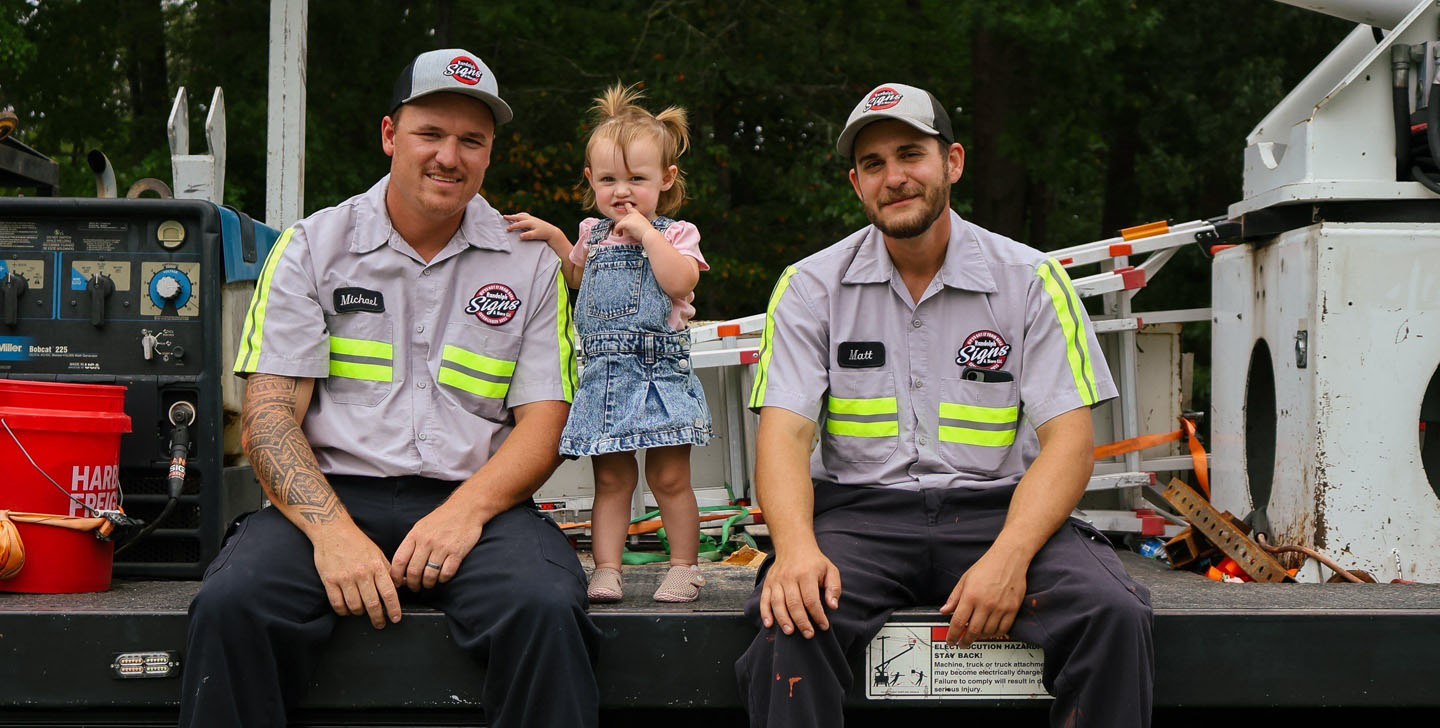 Michael and Matthew Peterson with Randolph Signs truck